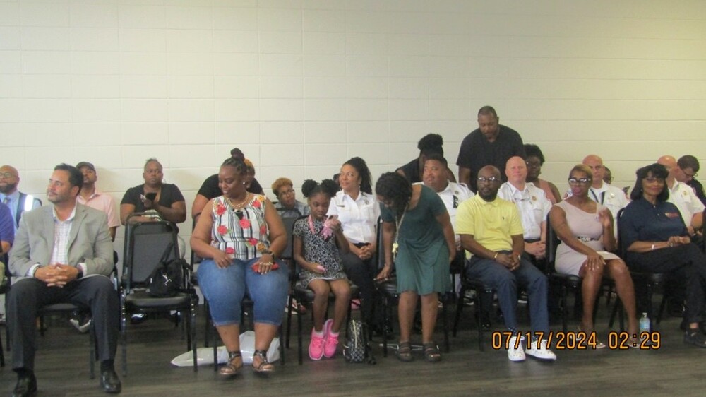 Parents, community partners, and city officials waiting on graduates.