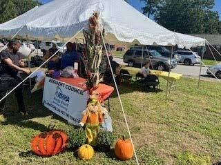 A canopy with pumpkins around it.