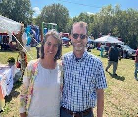 A man and a woman standing together for a photo.