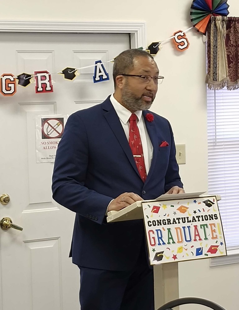 A man speaking at a podium.